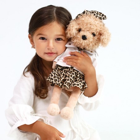 Peluche chien debout en robe léopard, veste zippée blanche et bandeau assorti